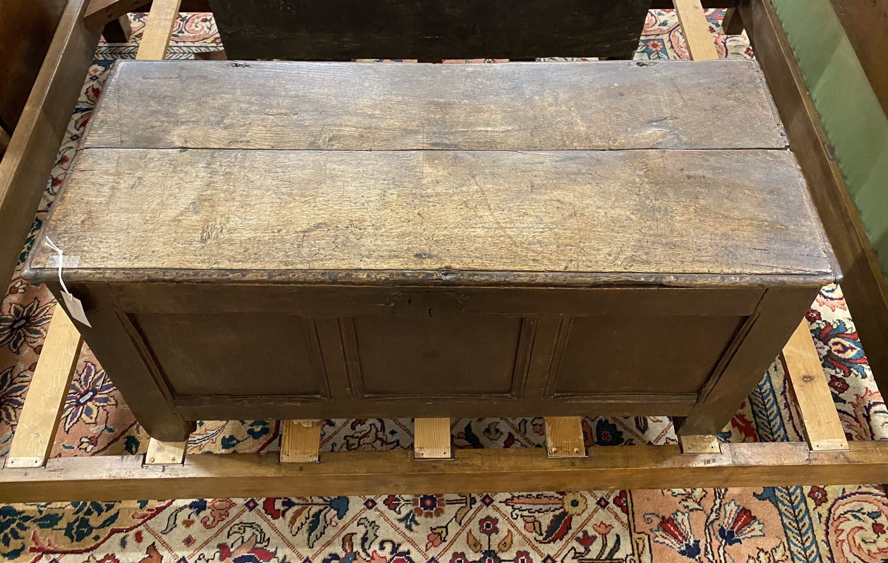 An 18th century panelled oak coffer, length 114cm, depth 47cm, height 56cm
